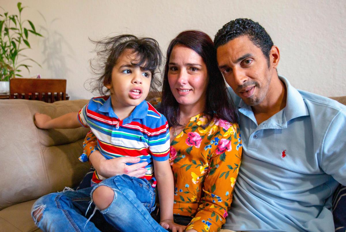 Arasay Penate, 37, and David Silva Batte, 39, with their special needs son David Silva Jr., 4, at their apartment in Miami on Sunday, May 3, 2020. The two parents lost their jobs during the coronavirus pandemic and David Jr.’s care facility closed down. Without daycare, they both can’t return to work.