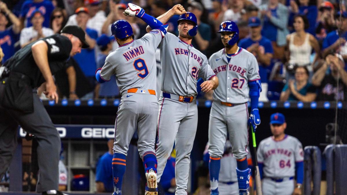 New York Mets batter Pete Alonso (20) reacts with base runner Brandon Nimmo (9) after he scored a two run homerun during the sixth inning of an MLB game at loanDepot park on Monday, March 31, 2025, in Miami, Fla.