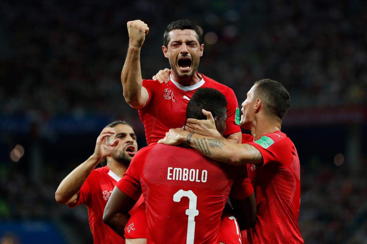 Switzerland's Blerim Dzemaili, top celebrates after scoring his side's first goal during the group E match between Switzerland and Costa Rica, at the 2018 soccer World Cup in the Nizhny Novgorod Stadium in Nizhny Novgorod , Russia, Wednesday, June 27, 2018.