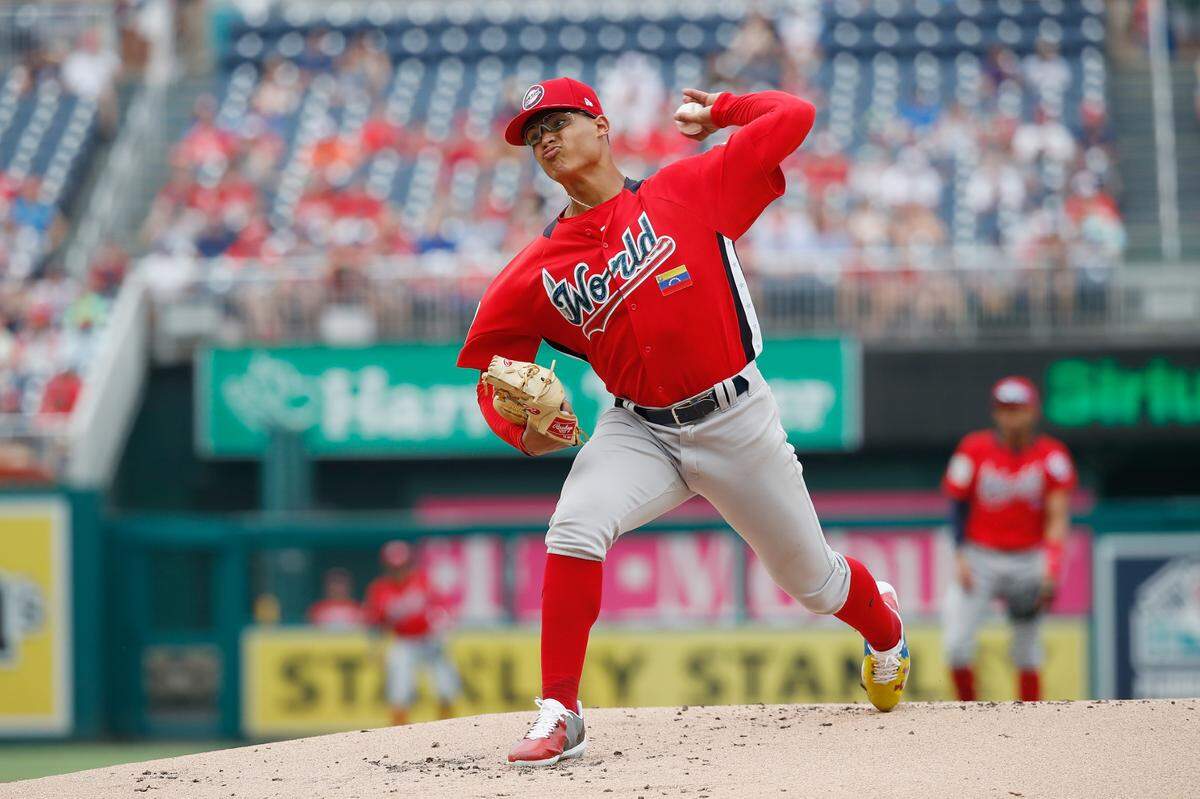 WASHINGTON, DC - JULY 15:  Starting pitcher Jesus Luzardo #9 of the Oakland Athletics and the World Team works the first inning against the U.S. Team  during the SiriusXM All-Star Futures Game at Nationals Park on July 15, 2018 in Washington, DC.  (Photo by Patrick McDermott/Getty Images)
