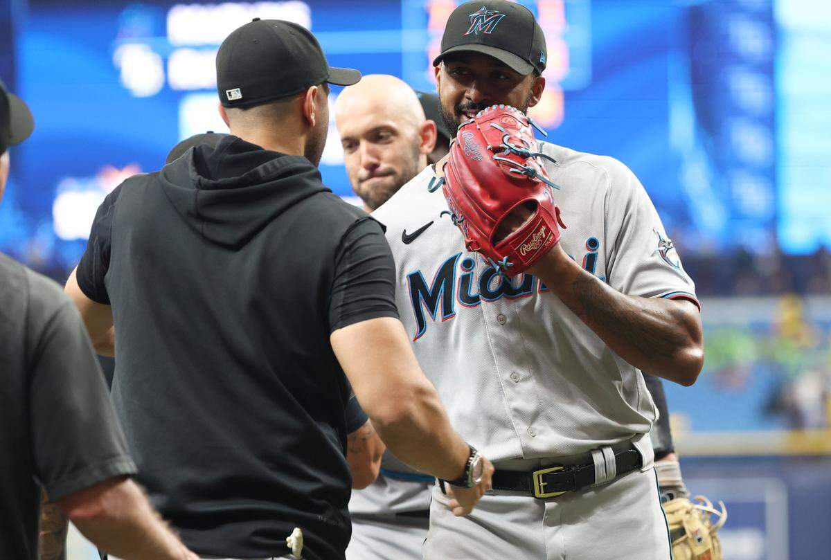 Jul 26, 2023; St. Petersburg, Florida, USA; Miami Marlins starting pitcher Sandy Alcantara (22) is congratulated after he threw a complete game against the Tampa Bay Rays at Tropicana Field.