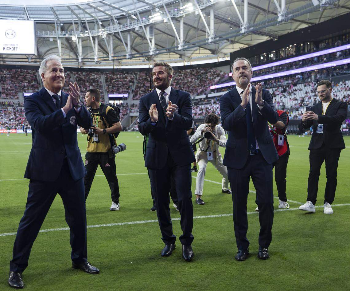 From left to right: Inter Miami CF owners Jorge Mas, David Beckham and Jose Mas applaud fans before their team’s MLS game against Austin FC at Nu Stadium in Miami Freedom Park on Saturday, April 4, 2026, in Miami, Fla.