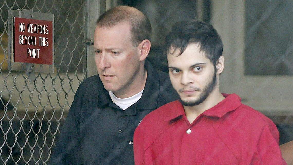 Fort Lauderdale-Hollywood International Airport shooter Esteban Santiago, right, is transferred from Broward County Jail to the Federal Courthouse in Fort Lauderdale for a detention hearing on January 17, 2017.