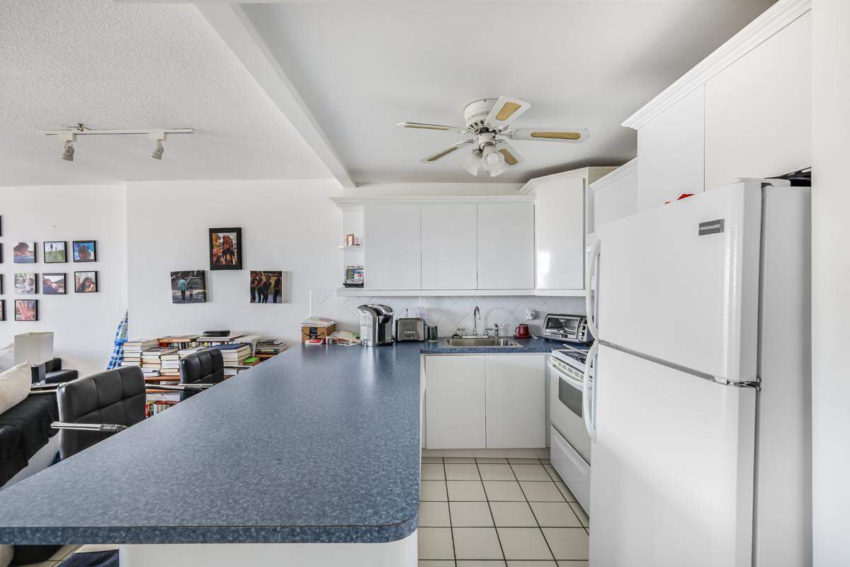 The kitchen of this unit in South Beach offers plenty of countertop space, but renters may have to settle for eating at the counter instead of having a formal dining space.