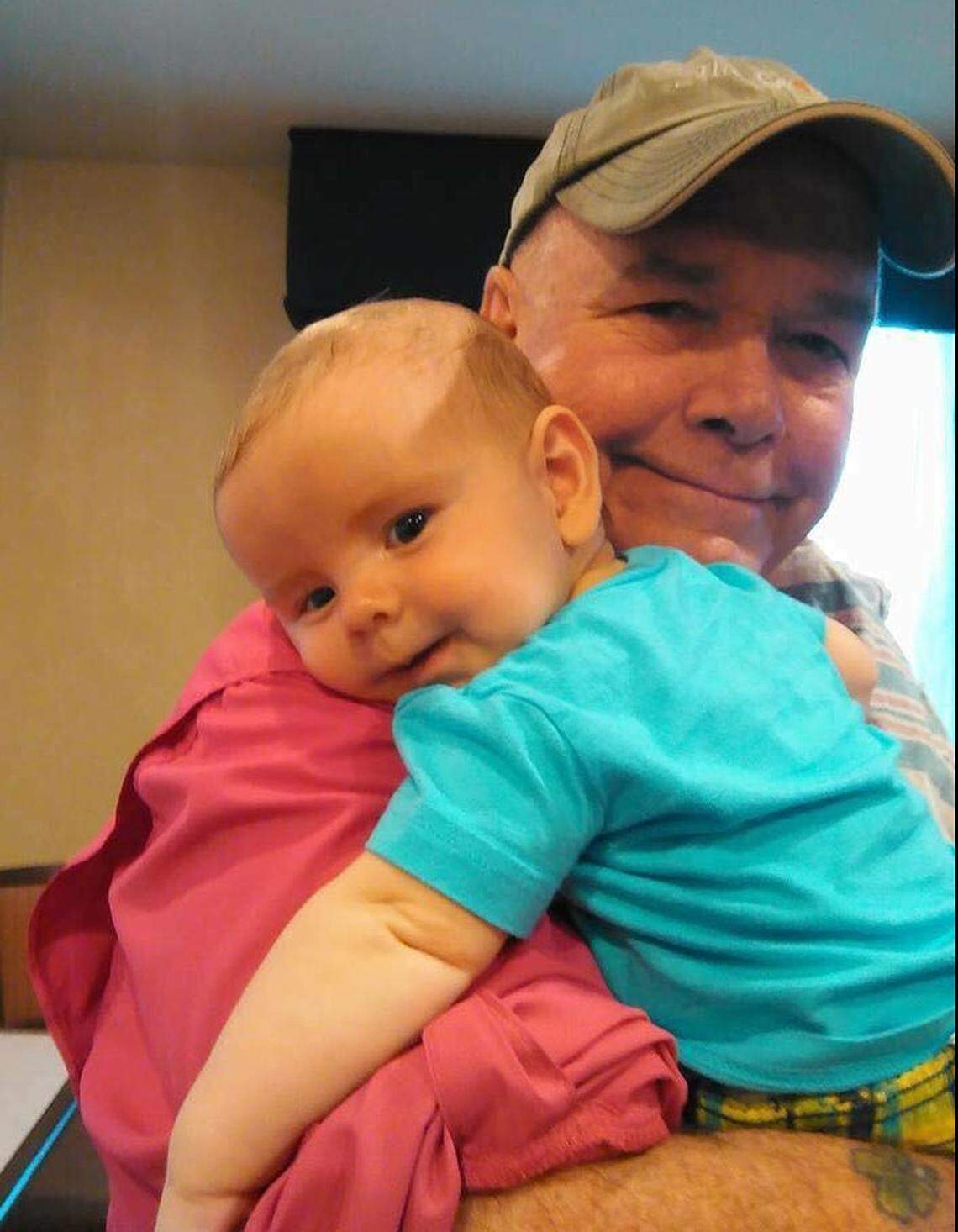 Tom Sheehan, 69, dotes on one of his 11 grandchildren. The Sarasota man is dying from COVID-19, which he caught while on the Costa Luminosa cruise ship.