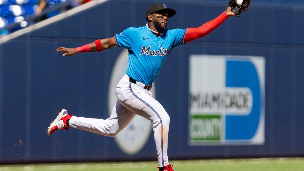 Miami Marlins second baseman Vidal Brujan (17) catches a fly ball during the eighth inning of a baseball game on Sunday, March 31, 2024, at loanDepot Park in Miami.