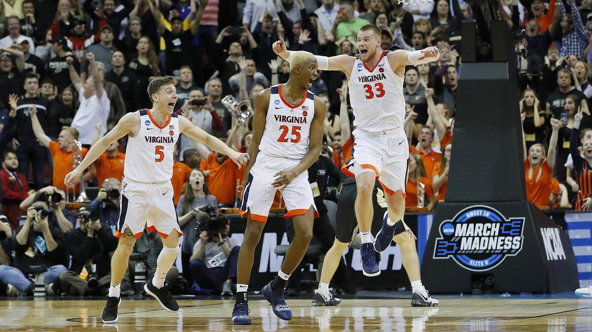 LOUISVILLE, KENTUCKY - MARCH 30: Mamadi Diakite #25 of the Virginia Cavaliers celebrates after making a game-tying shot over Matt Haarms #32 of the Purdue Boilermakers to extend the game to overtime as time expires in the second half of the 2019 NCAA Men’s Basketball Tournament South Regional at KFC YUM! Center on March 30, 2019 in Louisville, Kentucky. (Photo by Kevin C. Cox/Getty Images)