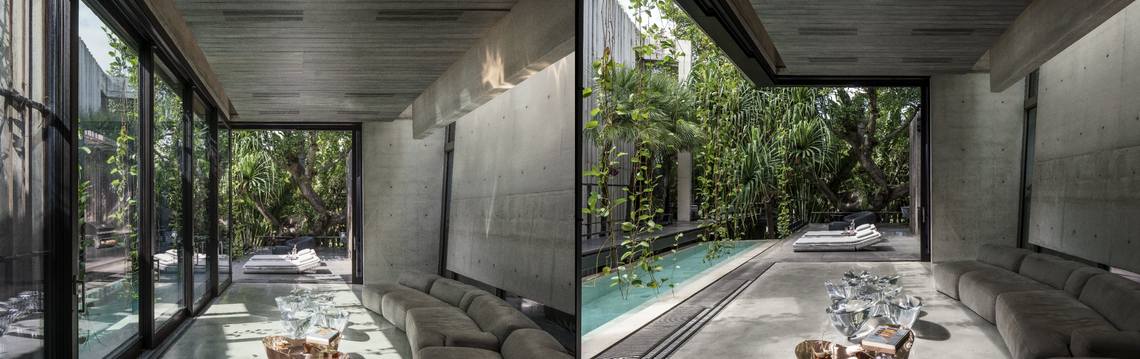 Glass panels slide away to open a room to the breeze at the Praire House, a Miami Beach house designed by Rene Gonzalez.