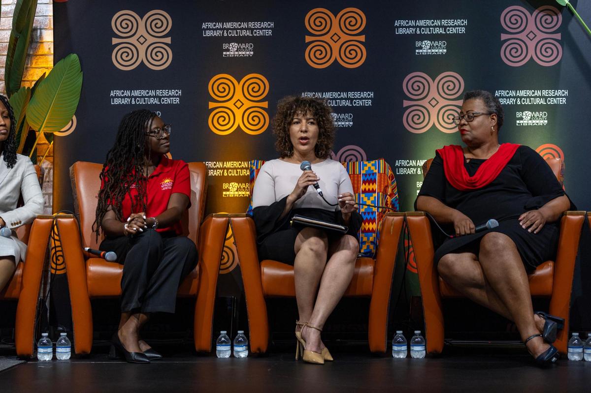 ACLU of Florida Executive Director Bacardi L. Jackson (center) speaks during the Out of Many, One Community: Combating Anti-Immigrant Rhetoric panel discussion hosted by South Florida People of Color at the African-American Cultural Research Center on Thursday, October 17, 2024, in Miami, Fla.