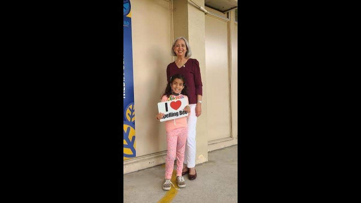 Judie ElAttar, 6, who won David Fairchild Elementary’s spelling bee. She is pictured with Hayde Siru, who was the school’s librarian and is on leave.