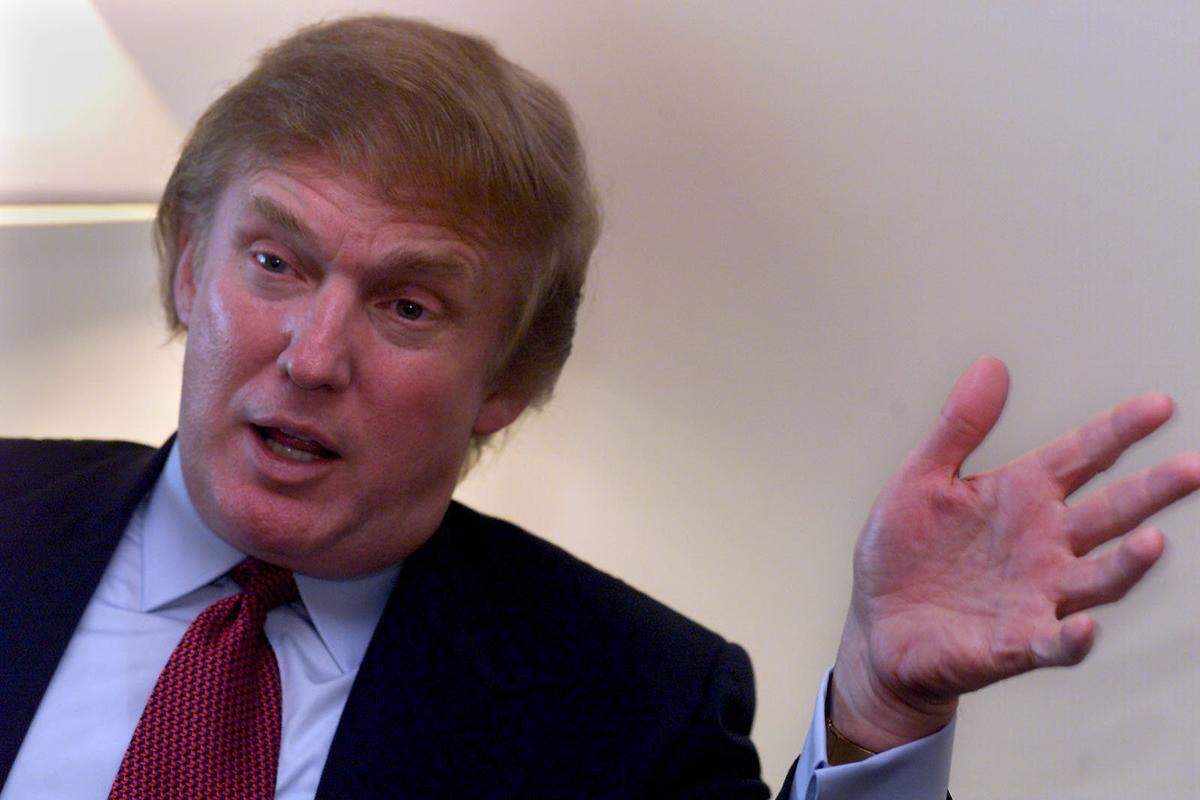 Donald Trump gestures to reporters during a visit to Miami in 1999.