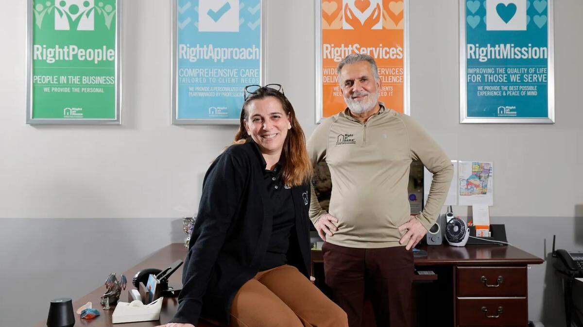 Care Coordinator Angela Audit, left, and owner Sidney Chugani, are shown at Right at Home in Dania Beach, Florida. The company enrolls clients in a free Medicare program for seniors with dementia and their caregivers.