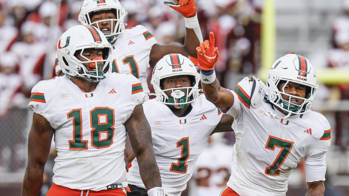 Miami Hurricanes safety Zechariah Poyser (7) and teammates react after sacking Virginia Tech Hokies quarterback Kyron Drones (1) in the second half at Lane Stadium in Blacksburg, Virginia, on Saturday, November 22, 2025.