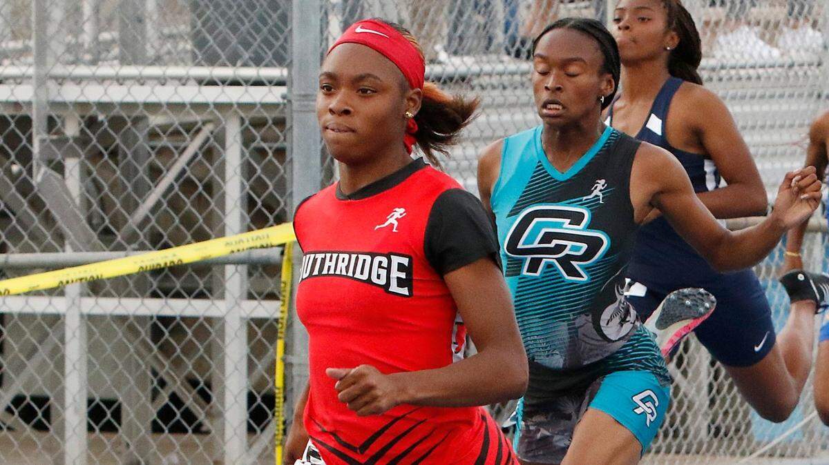Southridger’s Cynteria James wins girls 100 meter dash during the GMAC Track and Field Championship on Thursday, April 7, 2022 at Traz Powell Stadium in Miami. She set two meet records. Andrew Uloza / for THE MIAMI HERALD