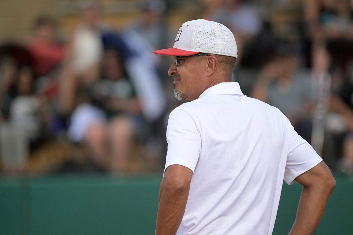Doral Academy head coach Willie Viruet watches during the seventh inning of an FHSAA State Championship Softball Game against Melbourne, Saturday, May 28, 2022, in Clermont, Fla. (Phelan M. Ebenhack for the Miami Herald)