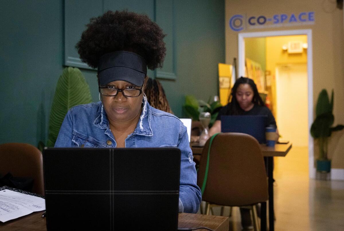 Patricia Laurenceau, a locally based web designer who found the co-work space on Instagram, works at Co-Space on Thursday, Jan. 11, 2024, in Miami Gardens. Laurenceau lives in the area. Before fining the space, she floated around wherever she could find a place work like Panera, Starbucks and the library.
