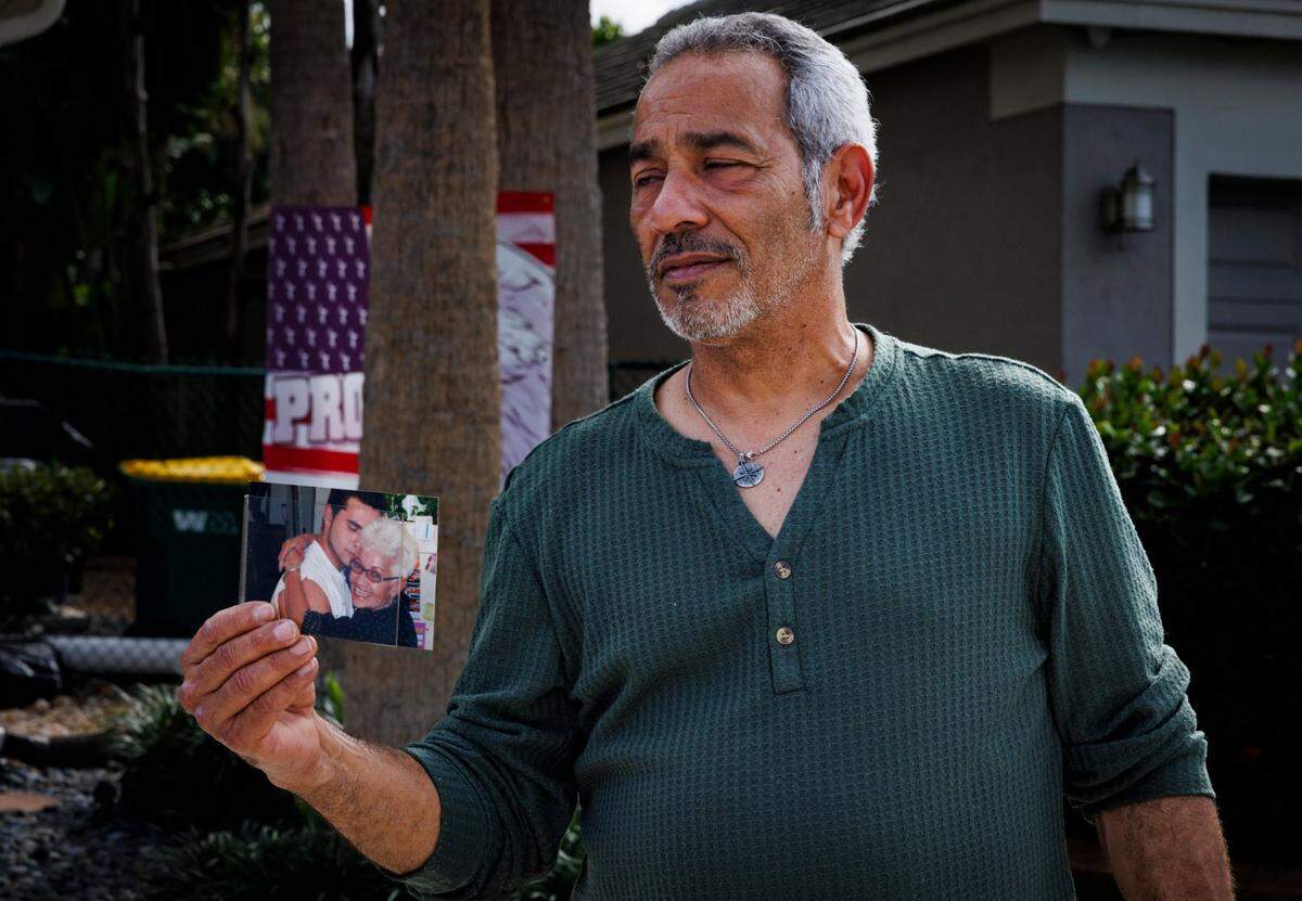 George David Jr., uncle of Andrew Ferrin who was killed over the weekend, holds a photo of Andrew with his grandmother, Tuesday, Feb. 18, 2025, in Tamarac, Fla.