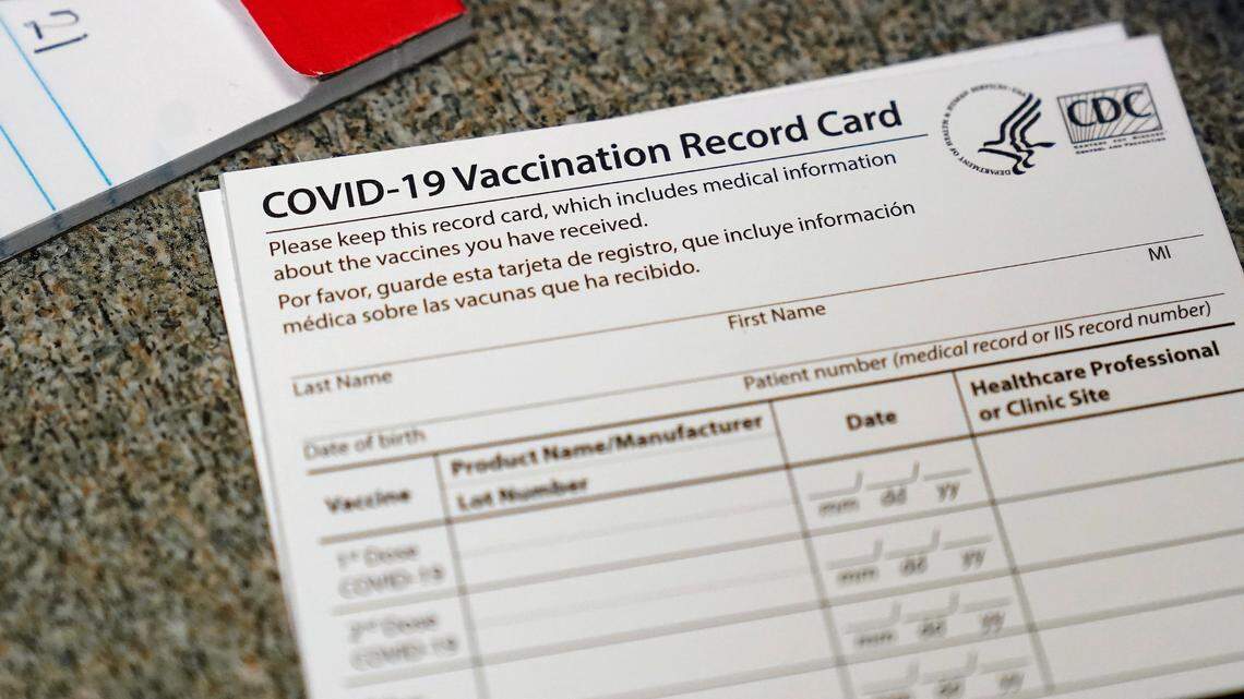 A photo of a COVID-19 vaccination card is shown. A Marine Corps reservist sold fake COVID-19 vaccine cards to other military members, NY officials said. He’s accused of working with a nurse to forge the cards.