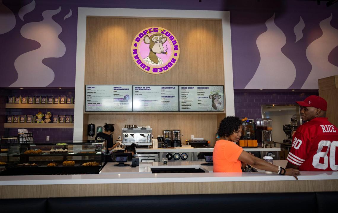 Customers await their orders during the soft opening for Bored Cuban fast-casual restaurant in Miami. The restaurant specializes in grab-and-go items, but you can eat there, too.