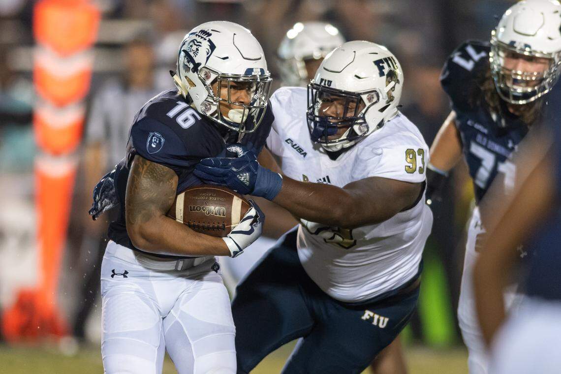 FIU Panthers defensive lineman Teair Tart (93) works to tackle Old Dominion Monarchs running back Brandon Sinclair (16) during the Saturday, Sept. 8, 2018 game held at Old Dominion University in Norfolk, Virginia. The Monarchs lead 14 to 0 during the second quarter.