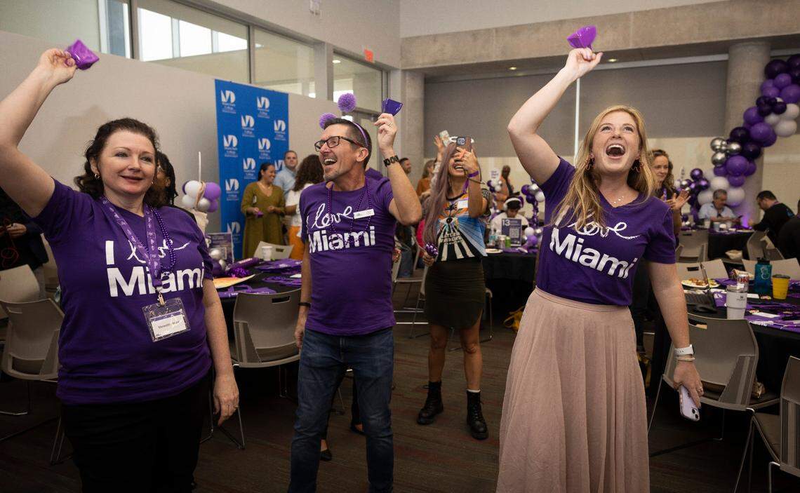 Steve Ryan, center, and Elise Grisoni, right, both from The Miami Foundation, celebrate hitting the $14 million mark with attendees during the Give Miami Day fundraising event hosted by The Miami Foundation on Thursday, Nov. 16, 2023, held at Miami Dade College Medical Campus. “Every time we hit a million dollars the rooms goes crazy, it’s not about whether my org or your org, it’s about the collective benefit for Miami,” said Miami Foundation CEO Rebecca Fishman Lipsey.