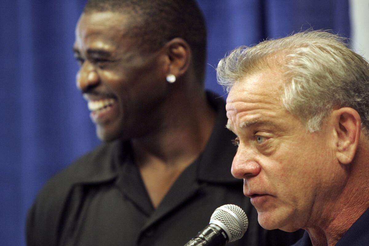 To Sports, 7/18/07. Photo by Candace West/Miami Herald Staff. St. Thomas Aquinas High School in Ft. Lauderdale. Michael Irvin returns to St. Thomas to officially donate $100,000 to his alma mater’s building fund to improve its athletic facilities. The football field is getting artificial turf, a new two story athletic center (named after football coach George Smith). Smith was coach to Irvin when he attended Aquinas and was a father figure. L to R are: Irvin and Smith.