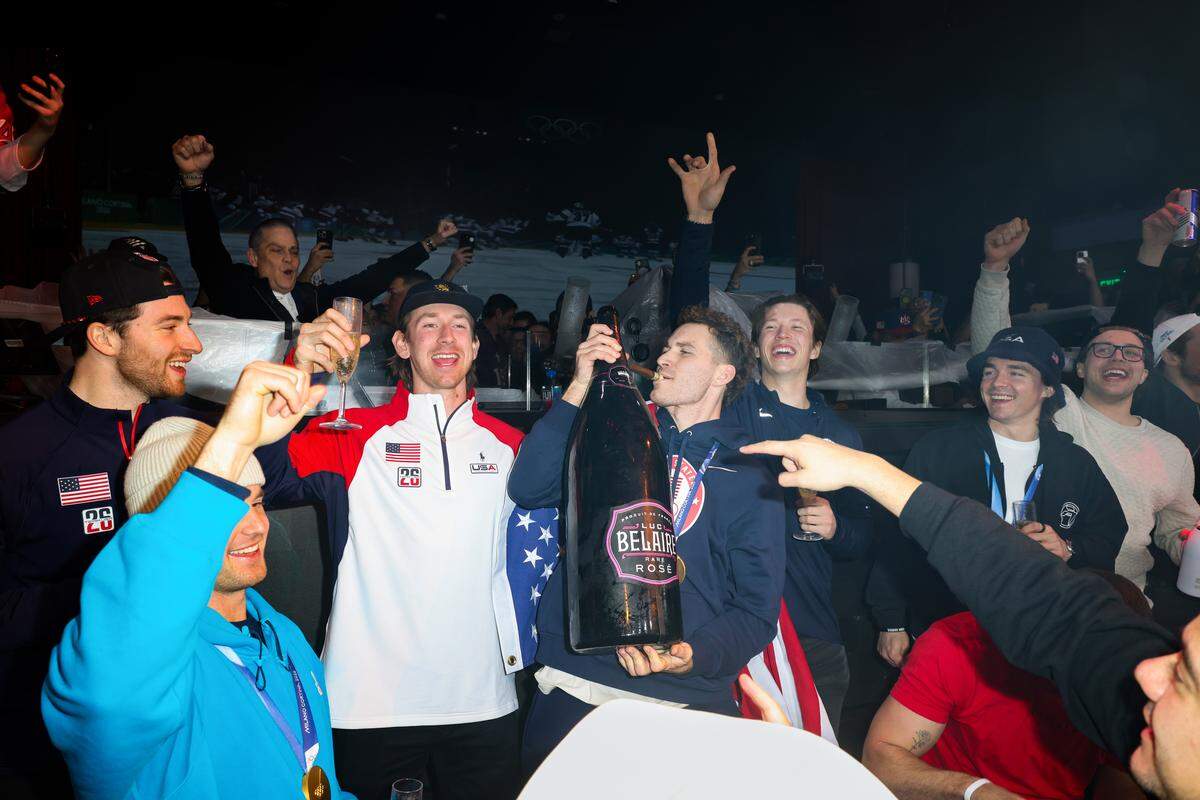 MIAMI, FLORIDA - FEBRUARY 23: Matthew Tkachuk celebrates with Jake Sanderson and the team during a celebration of the USA Men's Hockey Team's Olympic Gold at E11EVEN Miami on February 23, 2026 in Miami, Florida.  (Photo by Alexander Tamargo/Getty Images for E11EVEN Miami)