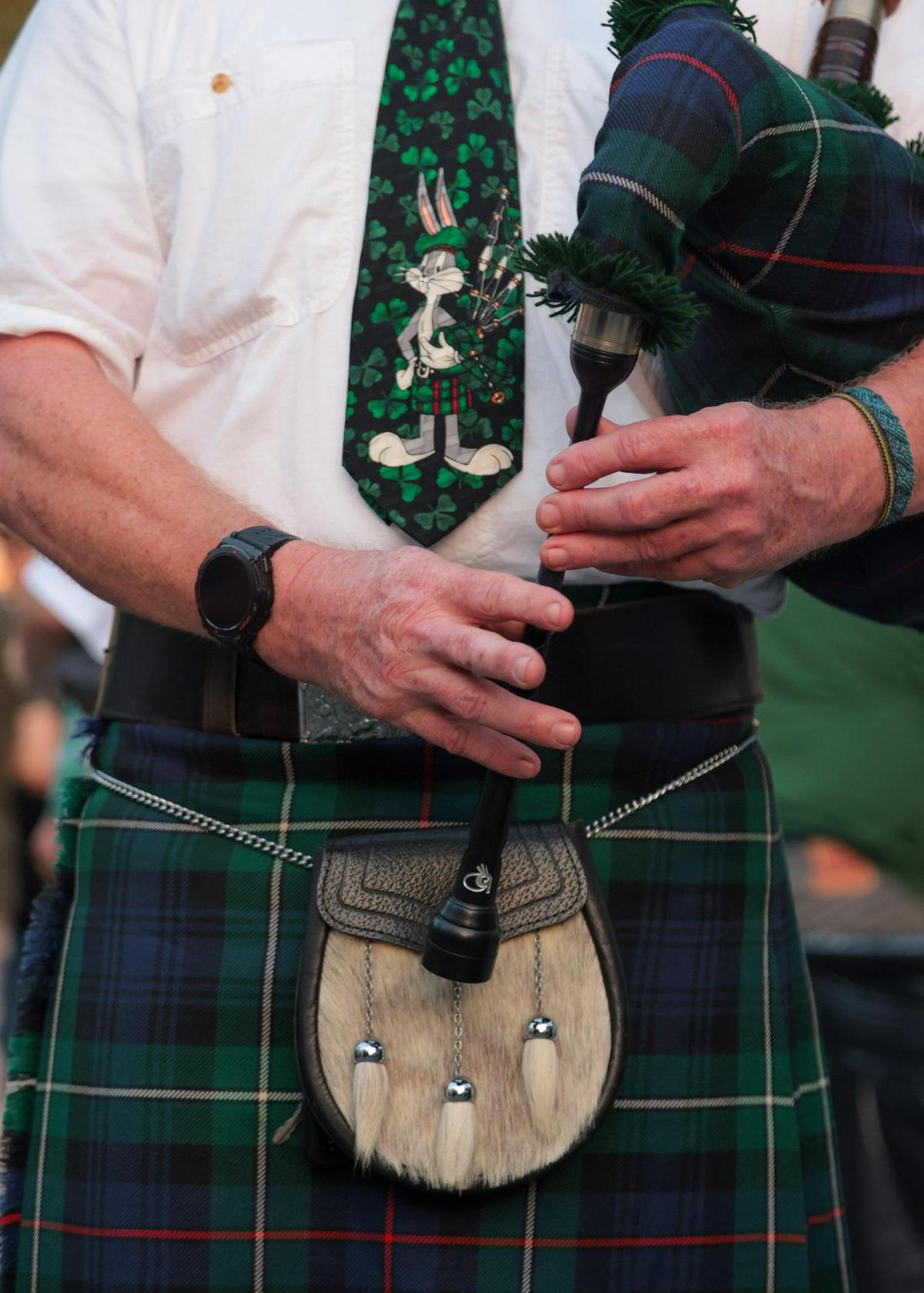 Neil Keppie of the Saint Andrews Pipe Band of Miami plays the bagpipes during the John Martin’s 32nd Annual St. Patrick’s Day Street Festival in Coral Gables, Florida, Saturday, March 15, 2025.
