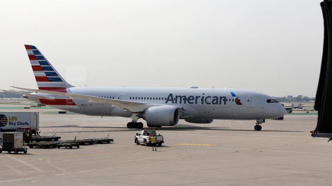 An American Airlines plane passenger refused to get off the phone and spit on someone, feds say.