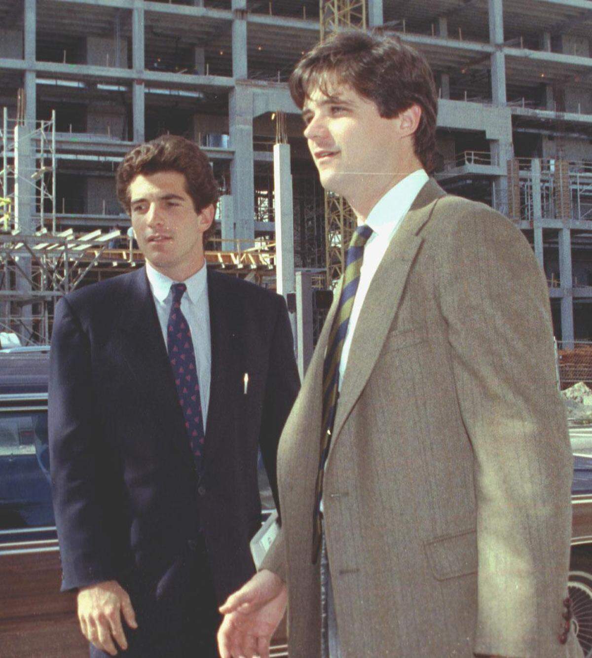 John F. Kennedy Jr., left, lends support of his cousin William Kennedy Smith, who was accused of rape at the Kennedy estate.
