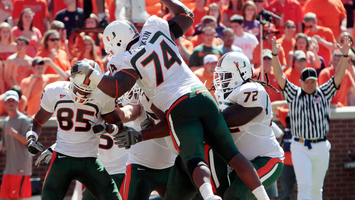 Former Miami receiver Leonard Hankerson (85) is mobbed by teammates, including Orlando Franklin (74) and Brandon Washington (72), after scoring a touchdown against Clemson during the second quarter of an NCAA college football game at Memorial Stadium in Clemson, S.C., Saturday, Oct. 2, 2010. (AP Photo/Patrick Collard)