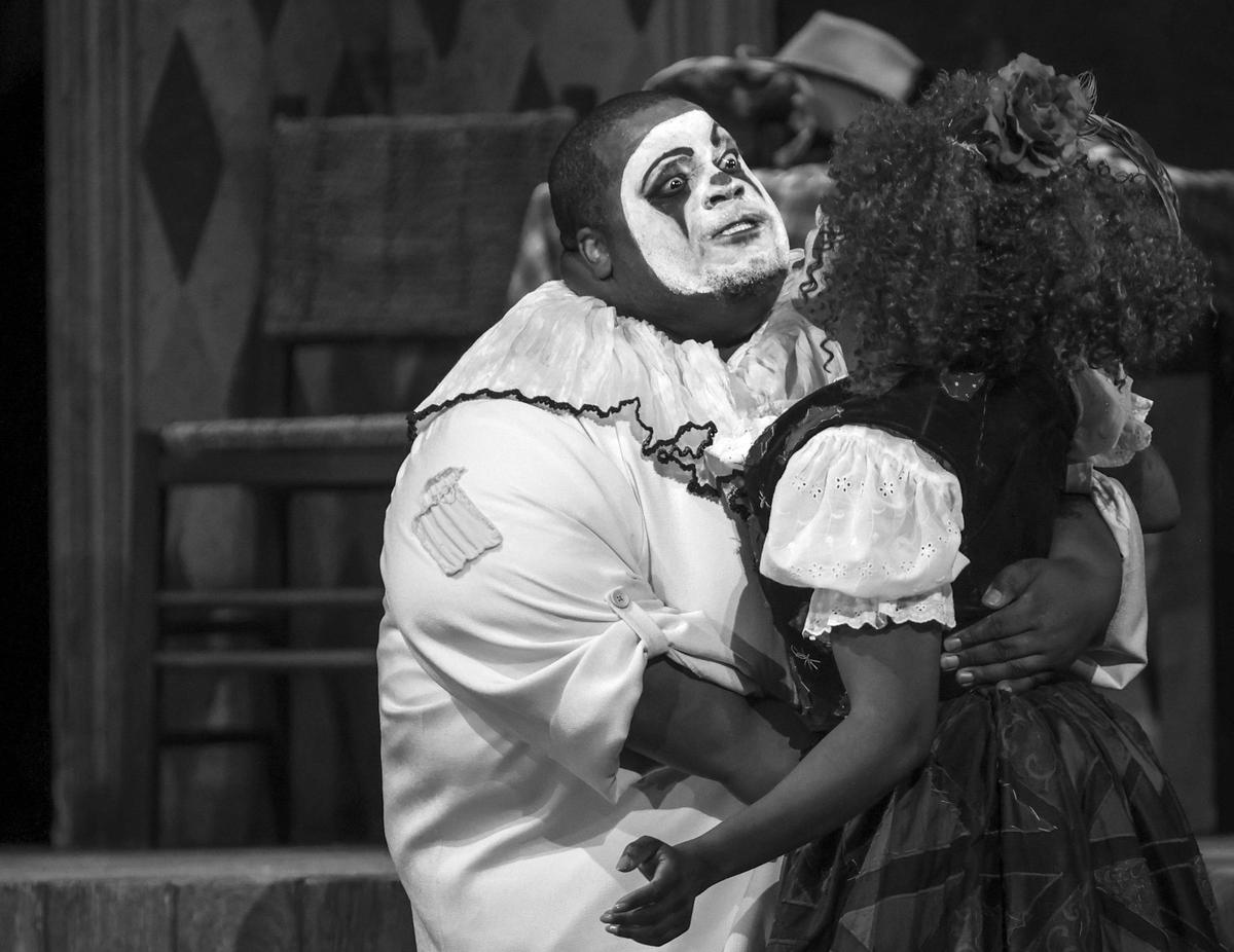 Opera singers Limmie Pulliam (Canio) stabs Kearstin Piper Brown (Nedda), right, during the climatic ending of ‘I pagliacci’ at the Adrienne Arsht Center in Miami.