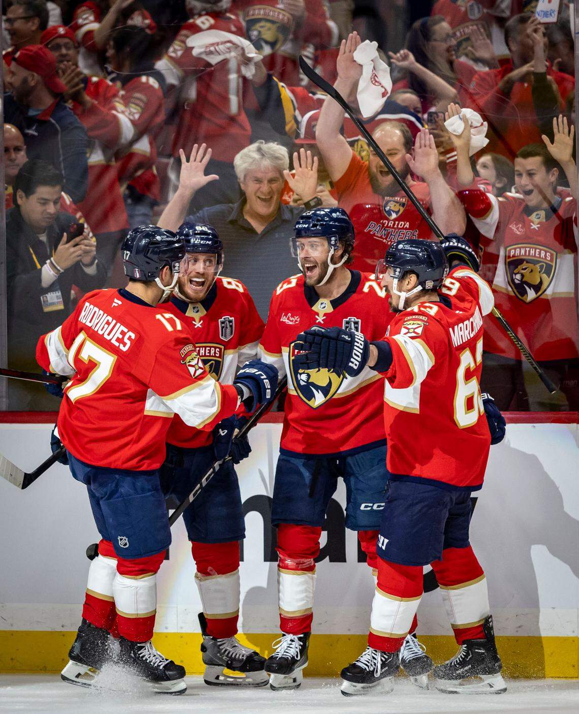 Florida’s Carter Verhaeghe, center, is congratulated by teammates after scoring to make the score 2-0 in favor of the Panthers during the first period of Game 3 in the NHL Stanley Cup Final series at Amerant Bank Arena on Monday, June 9, 2025, in Sunrise, Fla. 