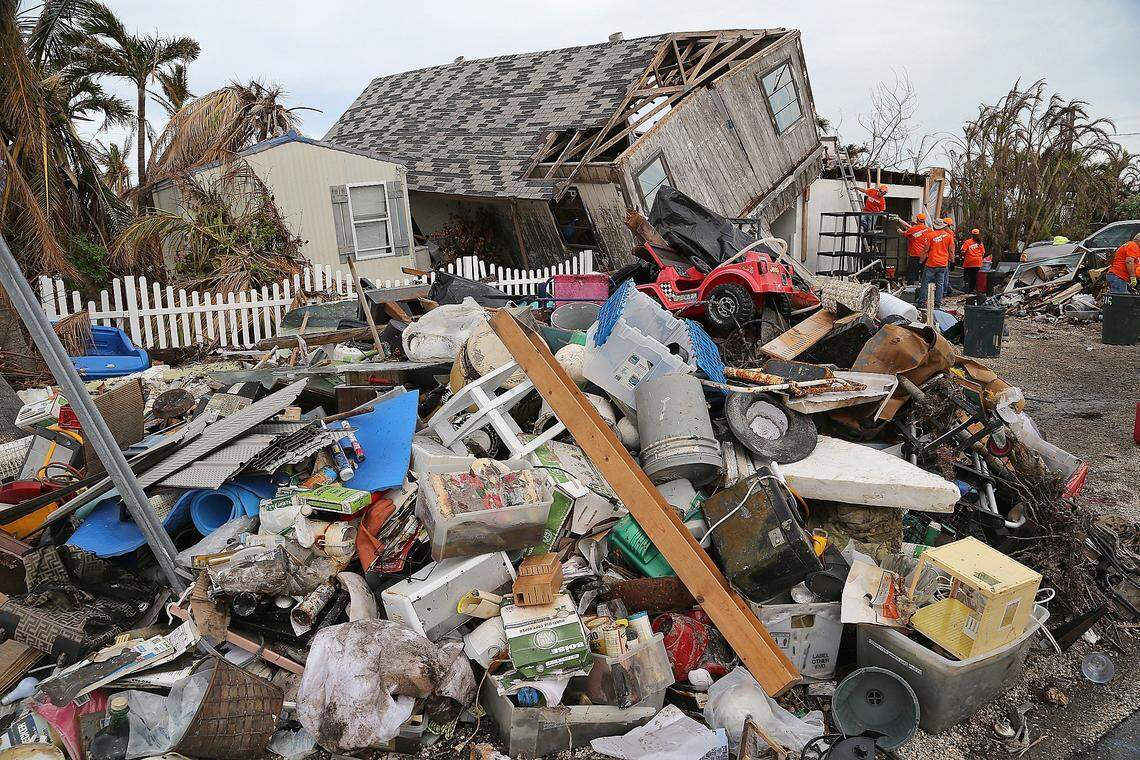 Volunteers work hard to clear and salvage the home of Joan Thoman.  A group of women distributed hot and cold meals to workers, volunteers, and residents rebuilding Big Pine Key on Oct. 25, 2017.