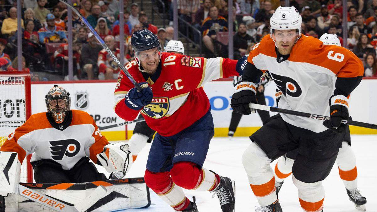 Florida Panthers center Aleksander Barkov (16) looks at Philadelphia Flyers defenseman Travis Sanheim (6) while going after the puck during the second period of a NHL game on Thursday, March 7, 2024 at Amerant Bank Arena in Sunrise, Fla.