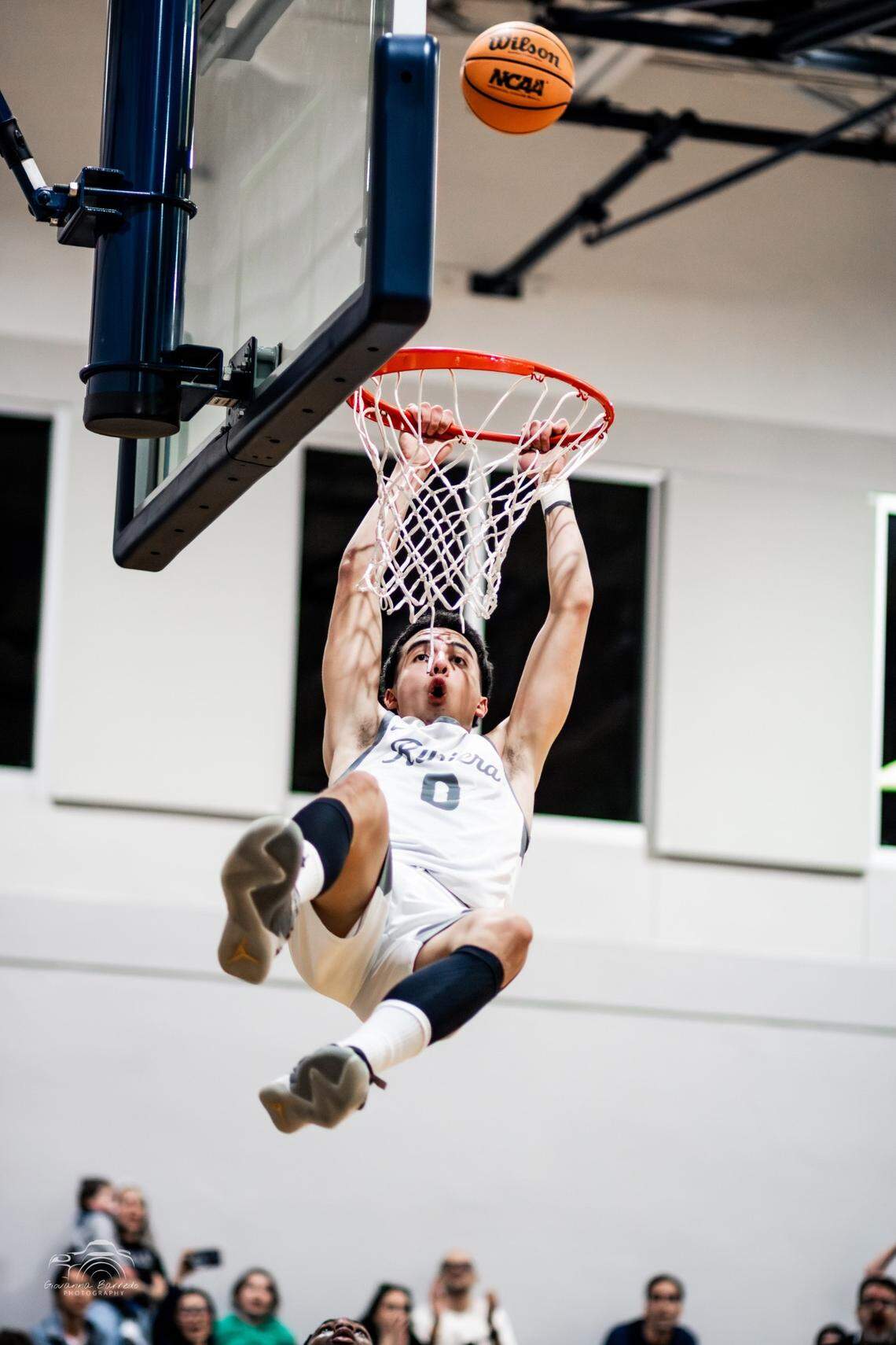 Riviera Prep guard Myles Fuentes soars for a dunk during a game earlier this season.