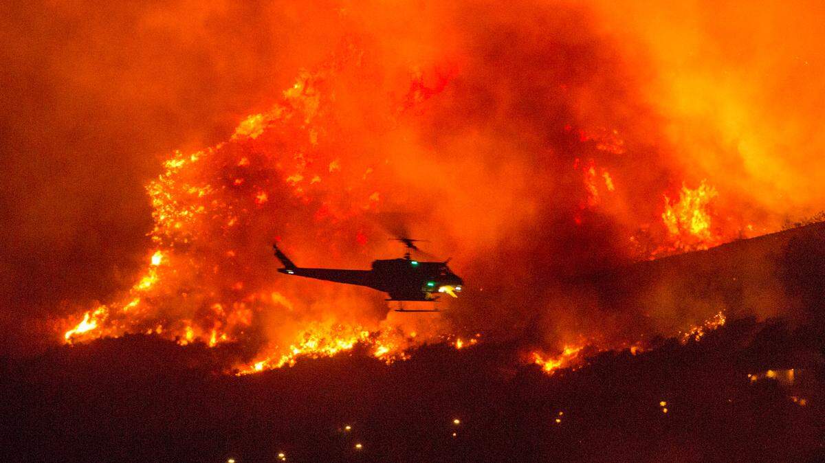 A couple’s plan to reveal their baby’s gender at a party went up in smoke at El Rancho Dorado Park in Yucaipa, California, in September when a pyrotechnical device they used sparked a wildfire that has burned thousands of acres. Refugio Manuel Jimenez Jr. and Angela Renee Jimenez face 22 charges, County DA Jason Anderson said.
