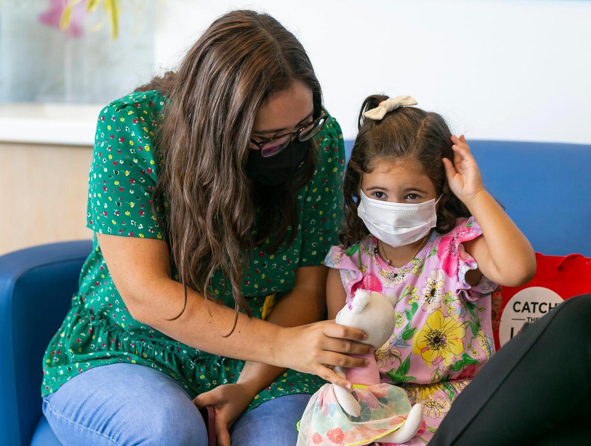 Jordanna Podesta and her daughter, Olivia Podesta, 3, visit Daniella’s Atrium on the fourth floor of Joe DiMaggio Children’s Hospital in Hollywood on Friday, June 18, 2021. Jordanna’s father, graffiti pop artist Jozza, donated two of his artworks to the hospital on Friday.