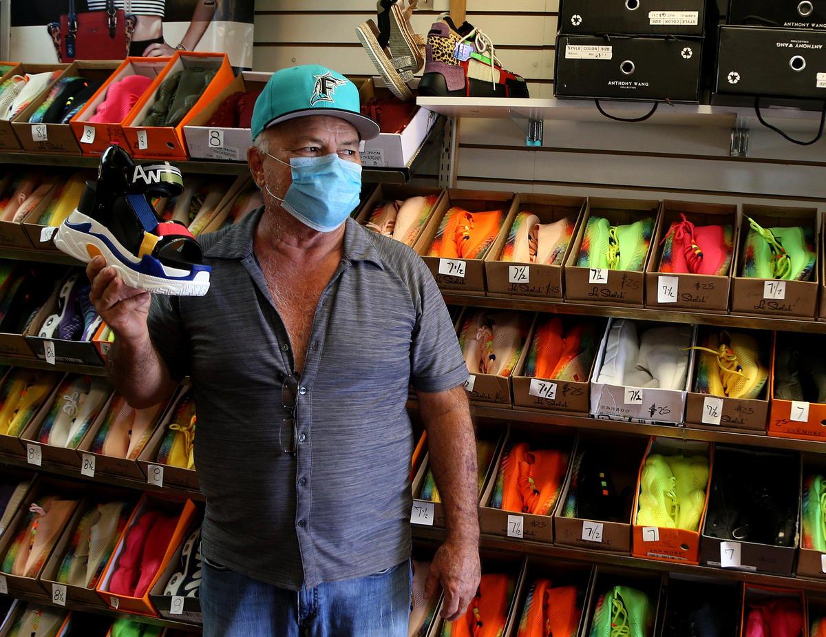 Jay Marquez, owner of a shoe store in Little Havana is eager to welcome back customers.