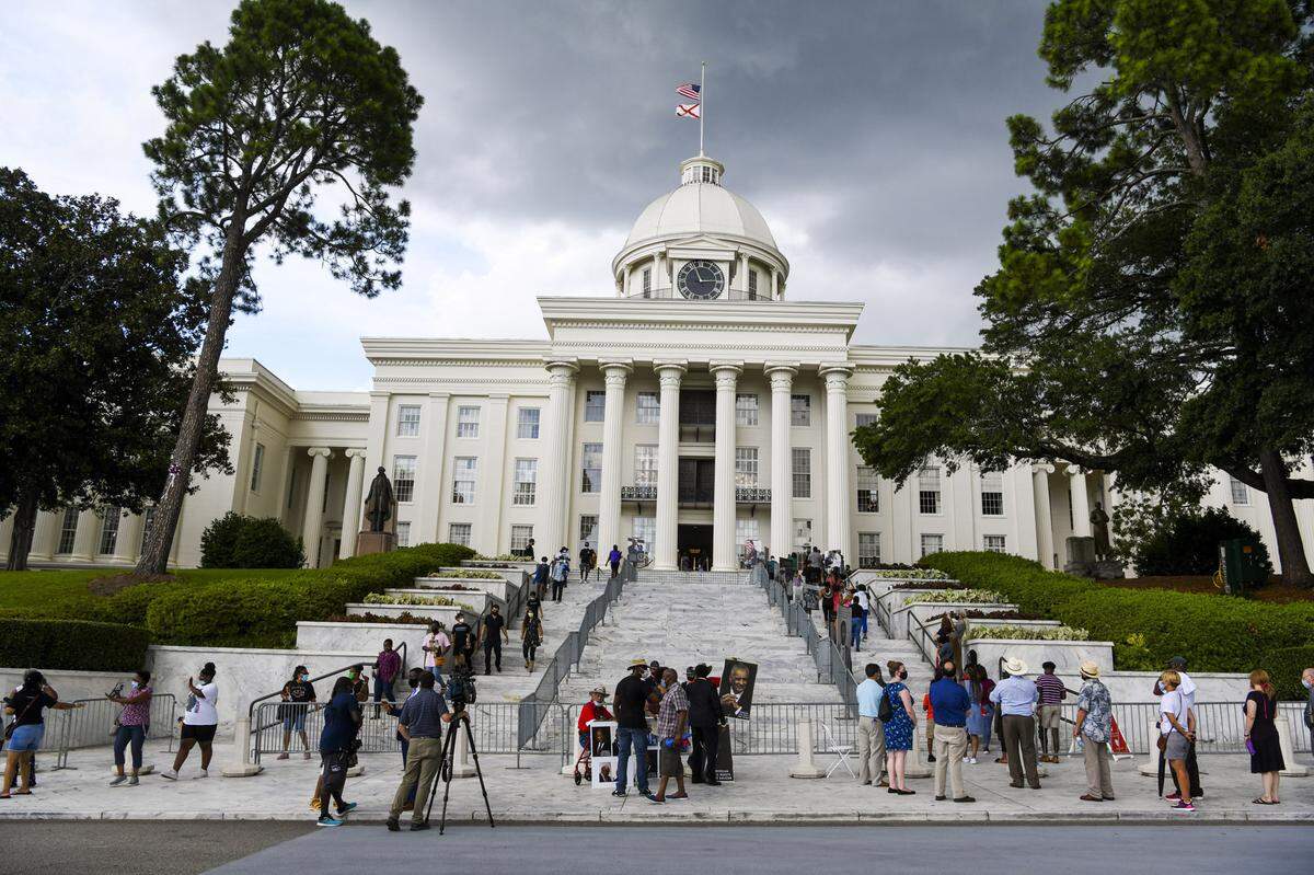 FILE - In this July 26, 2020, file photo, mourners gathered at the Alabama Capitol following the death of Rep. John Lewis. Alabama voters will decide whether to remove racist, segregation-era language from the state’s 1901 Constitution in the upcoming election. If approved, the measure would go back to legislators and another statewide vote. (AP Photo/Julie Bennett, File)