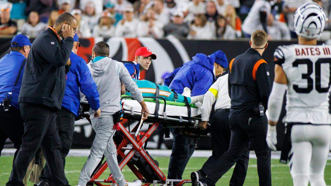 Miami Dolphins quarterback Tua Tagovailoa (1) is being transported by medical team after being sacked by Cincinnati Bengals defensive tackle Josh Tupou (68) during the second quarter of an NFL football game at Paycor Stadium on Thursday, September 29, 2022 in Cincinnati, Ohio.