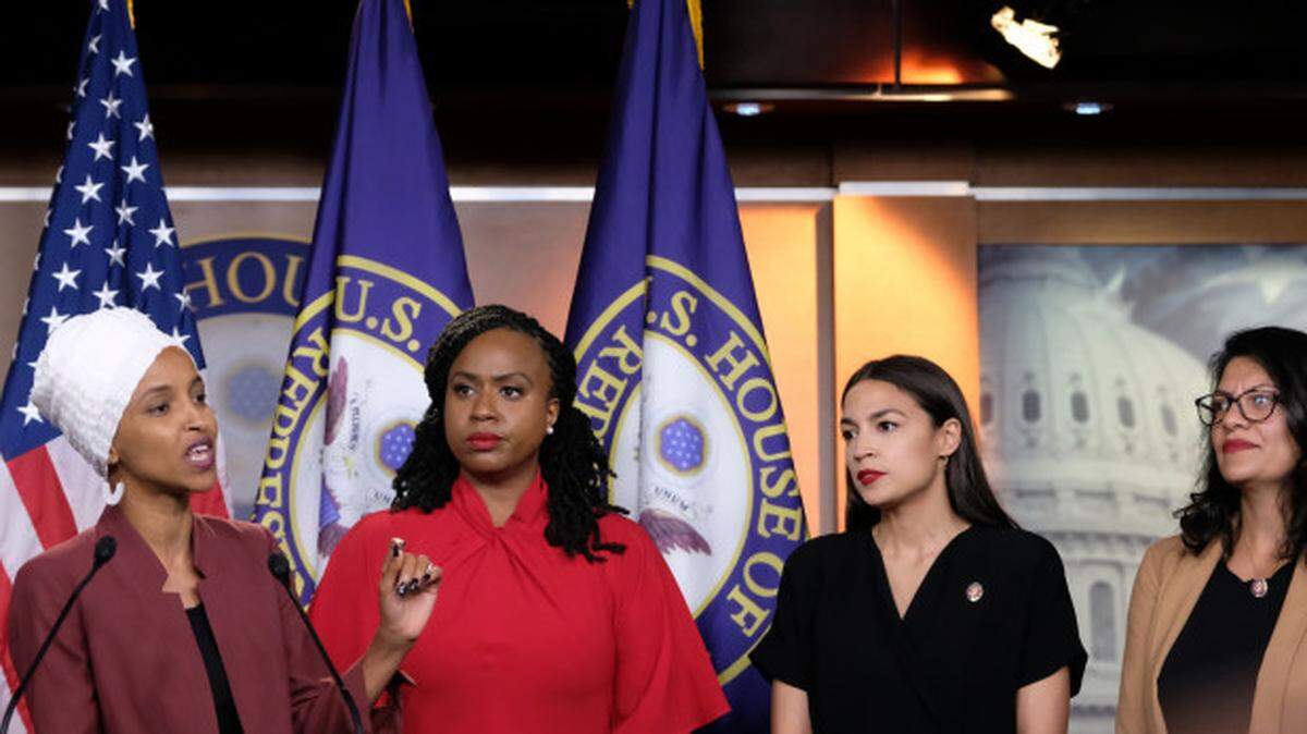 U.S. Rep. Ilhan Omar speaks as Reps. Ayanna Pressley, Alexandria Ocasio-Cortez and Rashida Tlaib  listen during a July 15 press conference at the U.S. Capitol.