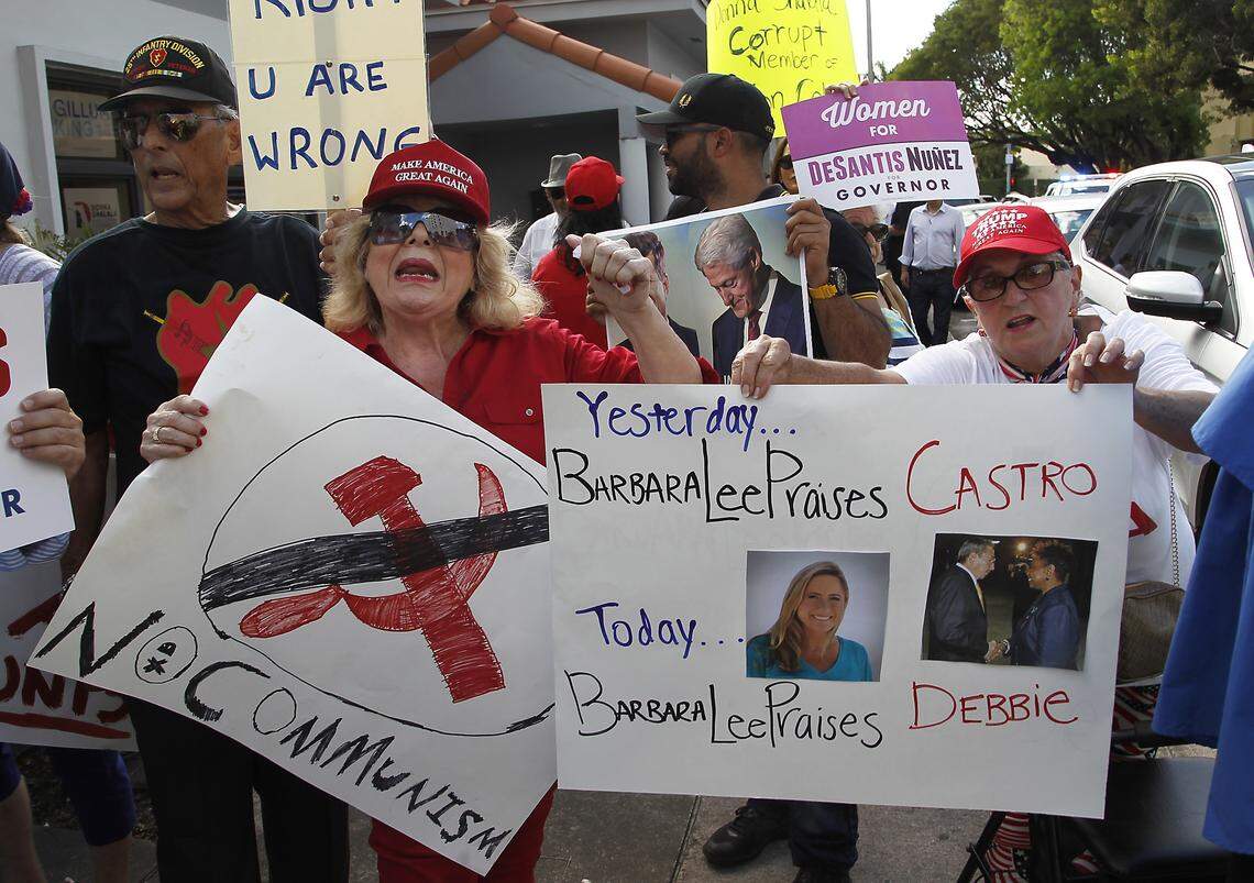 Pro-Trump demonstrators gathered Wednesday, Oct. 17, 2018, outside a GOTV canvass launch in Coral Gables in protest against House Democratic Leader Nancy Pelosi, Donna Shalala, and Debbie Mucarsel-Powell and a planned appearance from California lawmaker Barbara Lee, who has drawn scorn from the Cuban-American community for her support of the island nation’s late dictator Fidel Castro.
