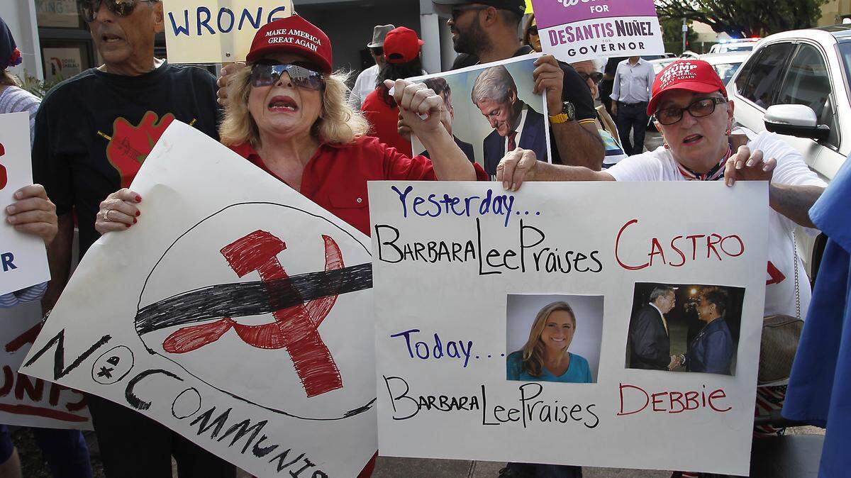 Pro-Trump demonstrators gathered Wednesday, Oct. 17, 2018, outside a GOTV canvass launch in Coral Gables in protest against House Democratic Leader Nancy Pelosi, Donna Shalala, and Debbie Mucarsel-Powell and a planned appearance from California lawmaker Barbara Lee, who has drawn scorn from the Cuban-American community for her support of the island nation’s late dictator Fidel Castro.