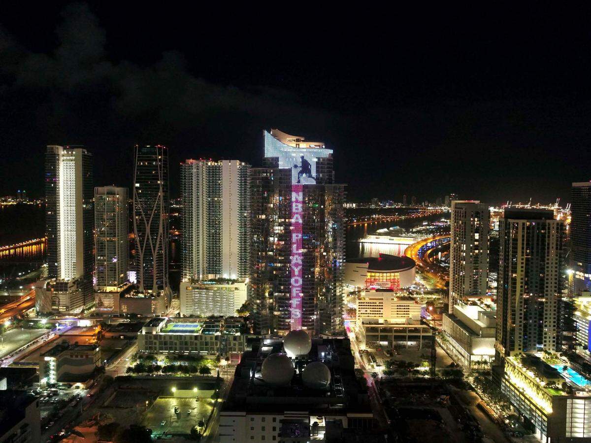 On the eve of the start of the NBA playoffs, South Florida’s skyline glows with the World’s tallest animated basketball player at the 60-story Paramount Miami Worldcenter tower in downtown Miami.