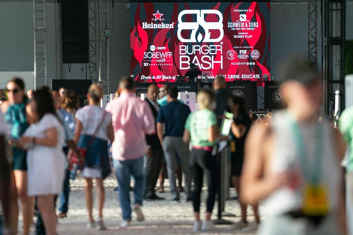 Guests attend the South Beach Wine & Food Festival’s Burger Bash in Miami Beach, Florida on Thursday, May 20, 2021.