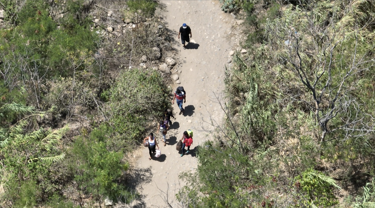 People cross the Venezuela-Colombia border through one of the numerous illegal trails known as ‘trochas’  that are often controlled by criminal groups. 