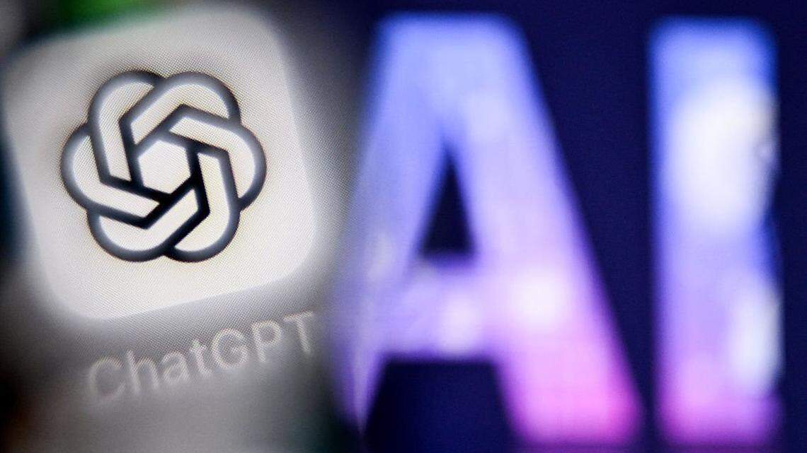 A photo taken on September 1, 2025 shows the letters AI for Artificial Intelligence on a laptop screen (R) next to the logo of the ChatGPT application on a smartphone screen in Frankfurt am Main, western Germany. (Photo by Kirill KUDRYAVTSEV / AFP) (Photo by KIRILL KUDRYAVTSEV/AFP via Getty Images)
