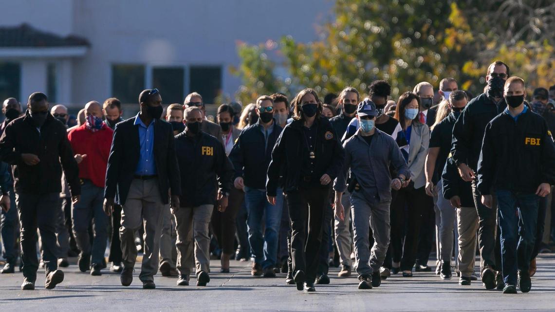 FBI agents leave the Broward County Office of Medical Examiner and Trauma Services in Fort Lauderdale on Tuesday after two FBI agents were shot and killed and others injured while serving a warrant at a Sunrise home.