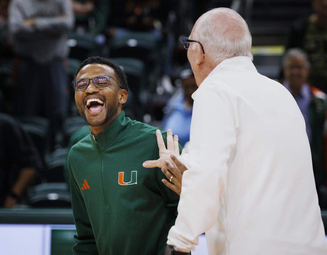 Former Head Coach Jim Larrañaga, right, laughs with current Miami Hurricanes head coach Jai Lucas before the first half of the game against the Florida State Seminoles on Tuesday, Jan. 20, 2026, at Watsco Center in Coral Gables, Fla.